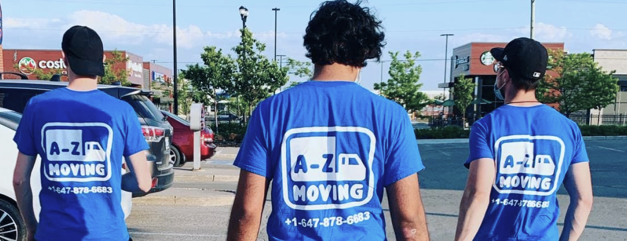 young-worker-loading-cardboard-boxes-delivery-van-communicating-with-his-colleague 1